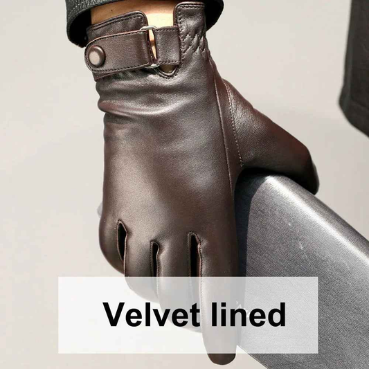 Black leather gloves with velvet lining from Mead's Supply & Equipment Outfitters, shown with detailed stitching and soft interior.