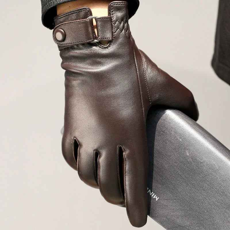 Black leather gloves with velvet lining from Mead's Supply & Equipment Outfitters, showing close-up of the textured leather and soft interior.