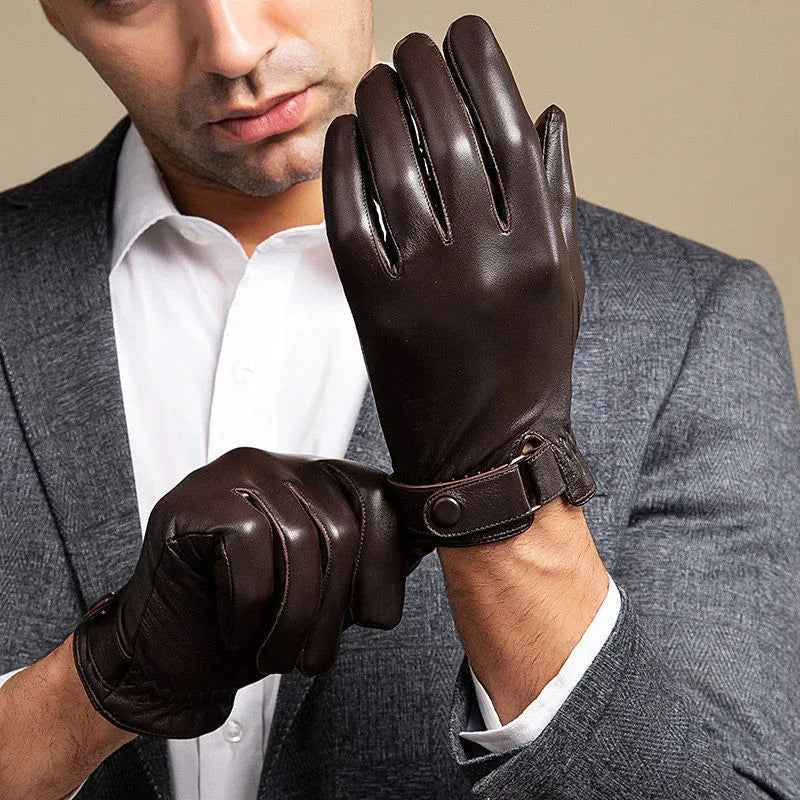 Black leather gloves with velvet lining from Mead's Supply & Equipment Outfitters, showing the detailed textured exterior and warm interior.