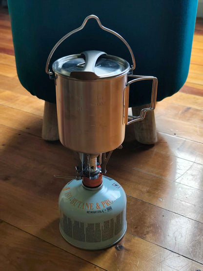Stainless steel 750ml camp cook pot with lid and hanging hook, fire and gas compatible, by Mead's Supply & Equipment Outfitters.