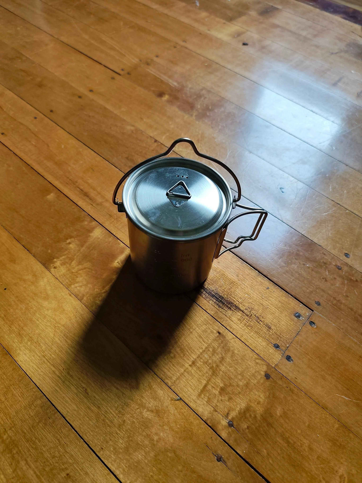 750ml stainless steel camp cook pot with lid and hanging hook, compatible with fire and gas, by Mead's Supply & Equipment Outfitters