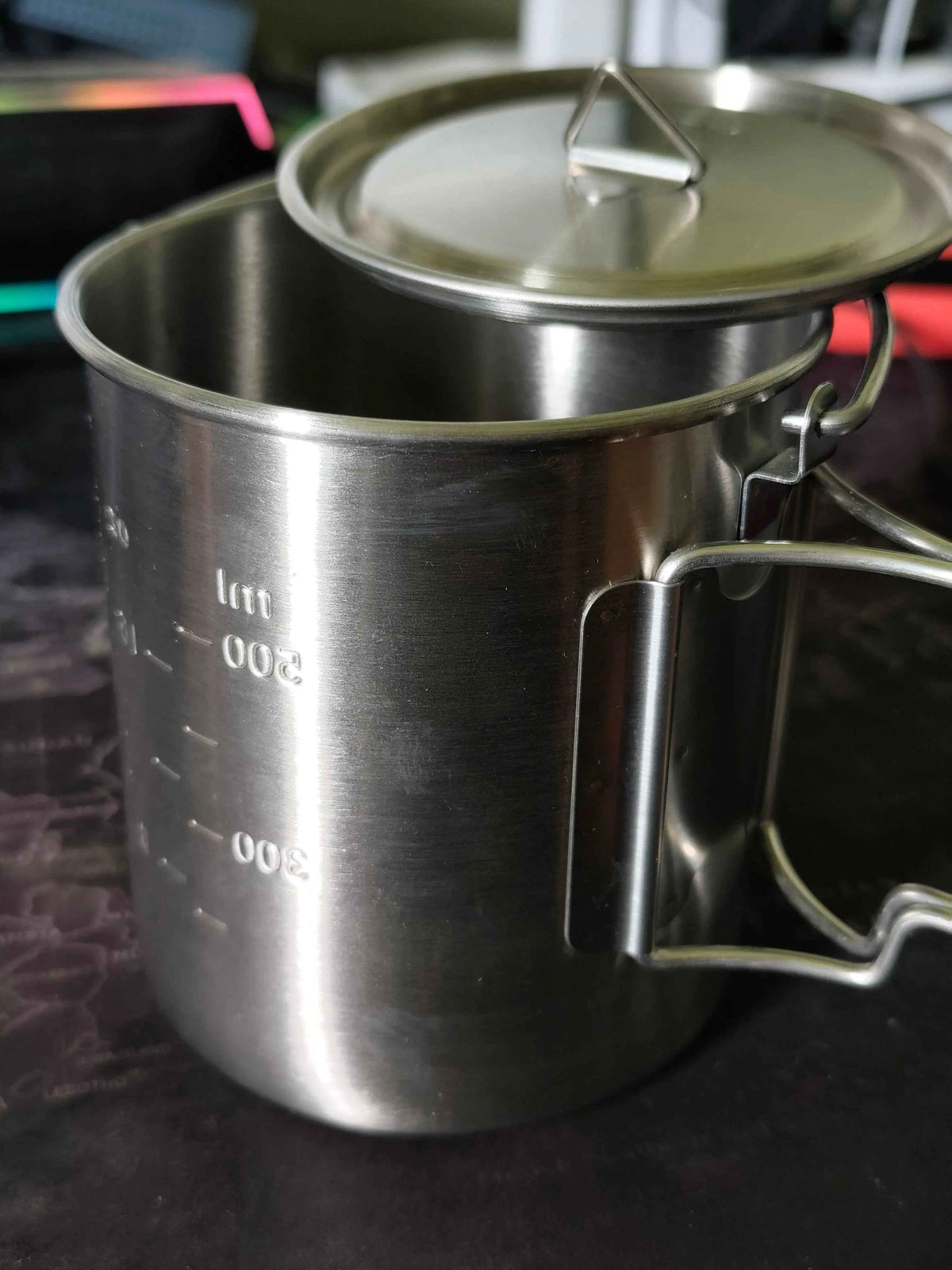 Stainless steel 750ml camp cook pot with lid and hanging hook, compatible with fire and gas, by Mead's Supply & Equipment Outfitters