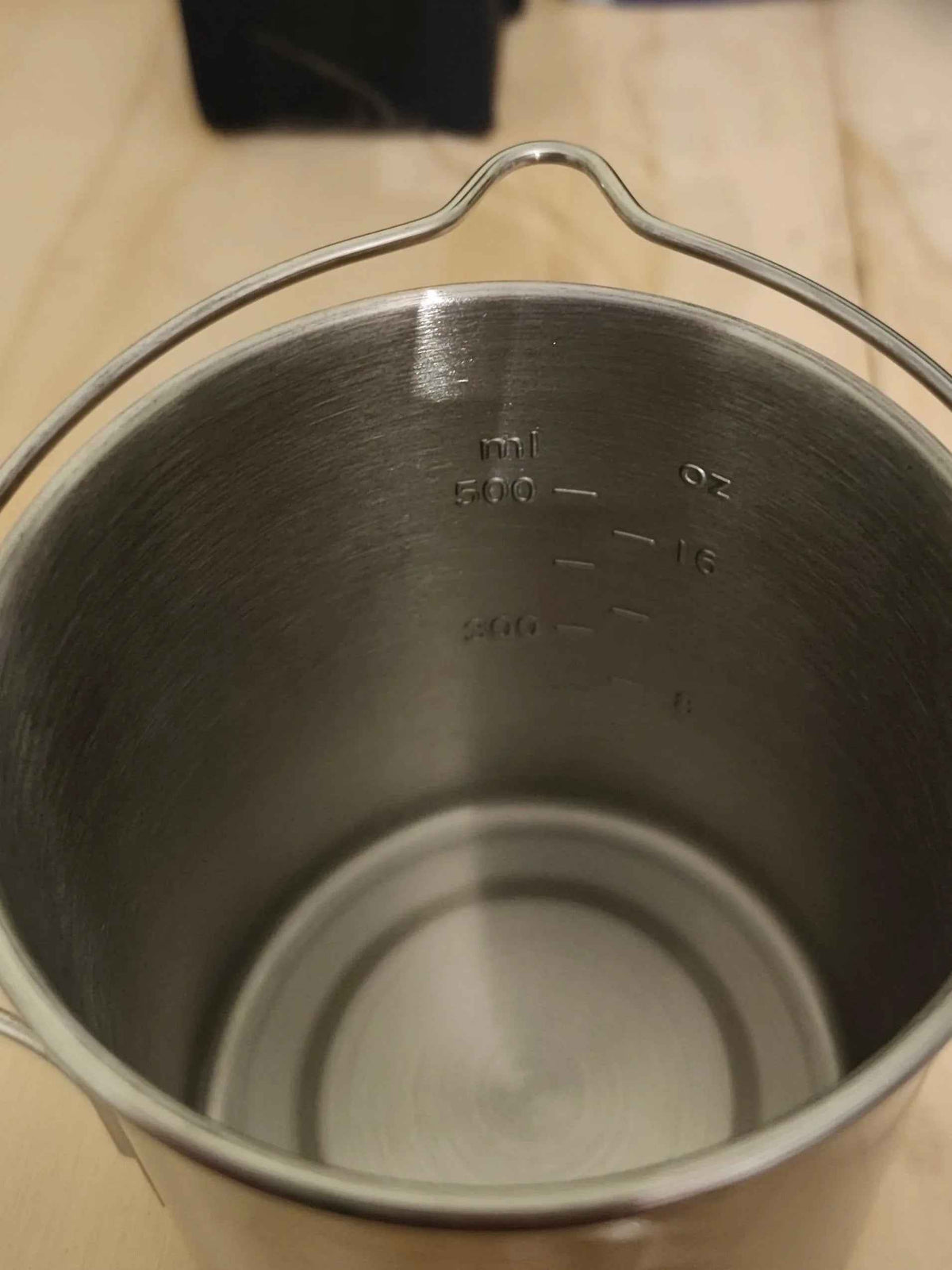750ml stainless steel camp cook pot with lid and hanging hook, fire and gas compatible from Mead's Supply & Equipment Outfitters.