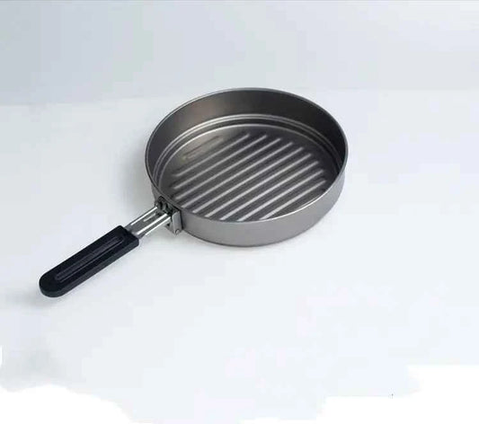 Folding thickened camping pot with two handles, made of titanium, portable camping cookware by Mead's Supply & Equipment Outfitters.