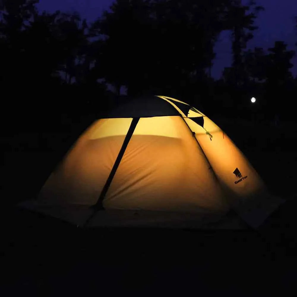 Outdoor folding camping tent in army green by Mead's Supply & Equipment Outfitters, set up on a camping site.
