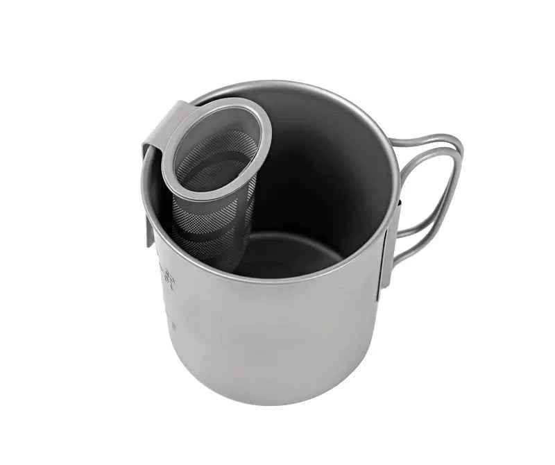 Titanium folding camping cup with lid, collapsible travel mug for outdoor use, lightweight titanium drinkware from Mead's Supply & Equipment