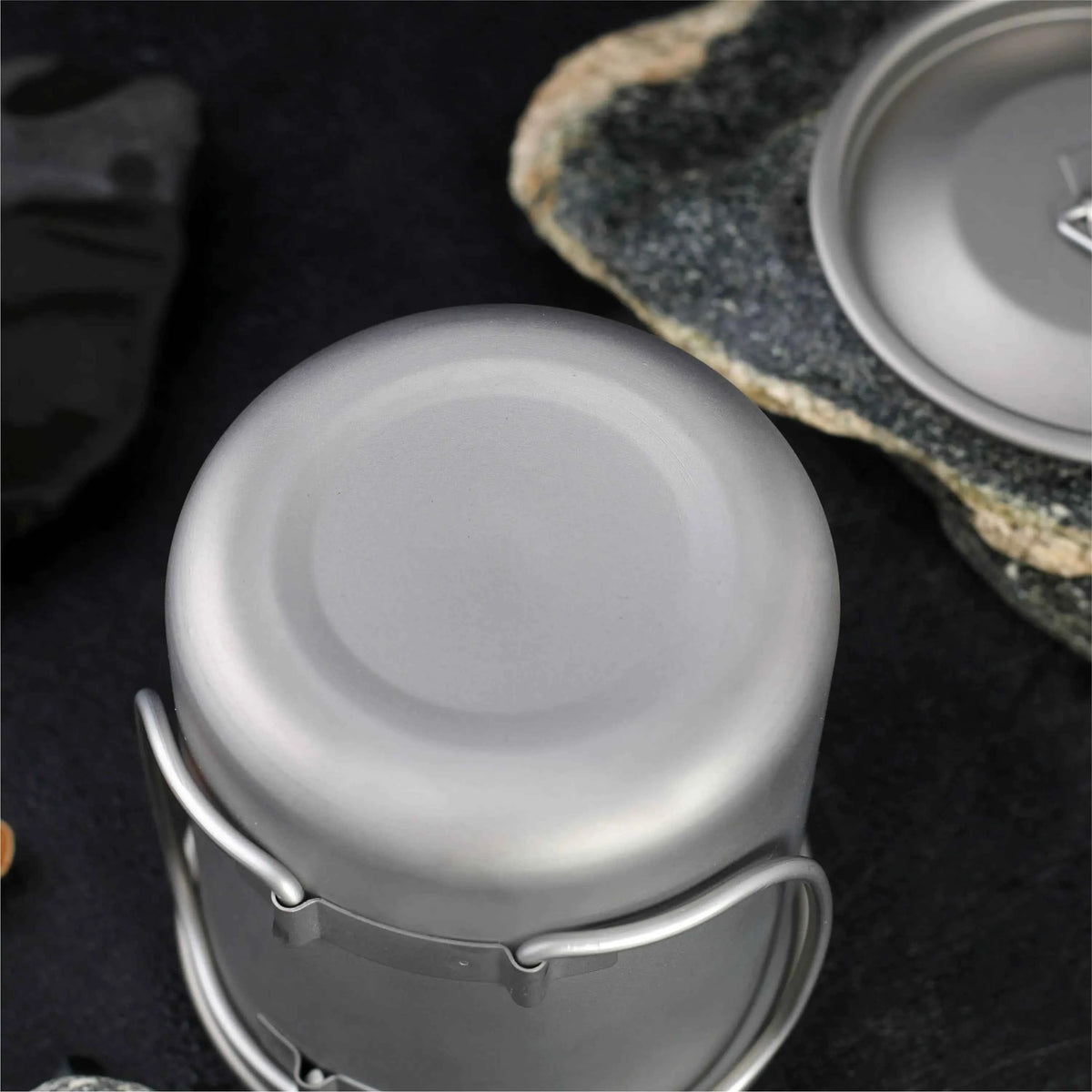 Titanium folding camping cup with lid, lightweight and collapsible outdoor travel mug for camping and hiking by Mead's Supply.