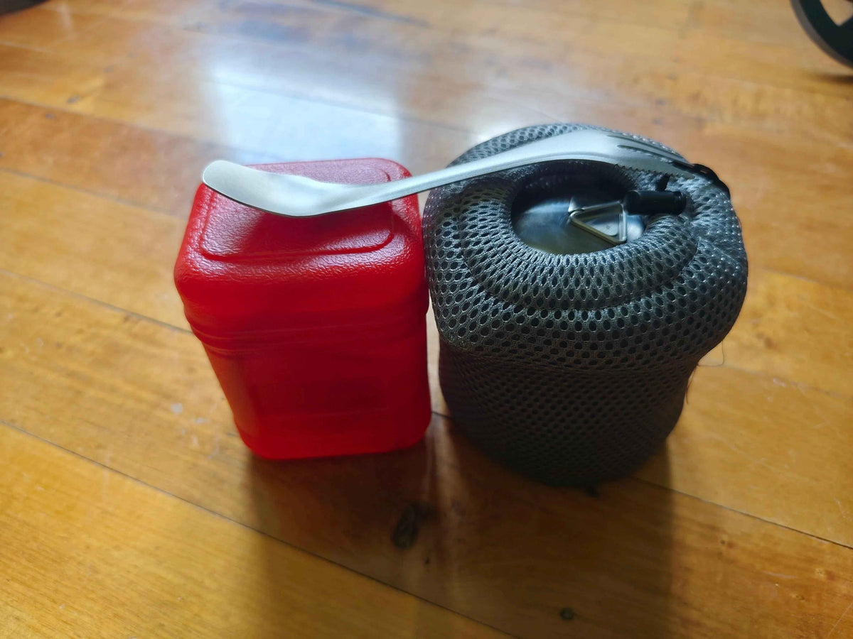 Complete camp kitchen bundle with pot, burner, and titanium utensil from Mead's Supply & Equipment Outfitters for camping gear.