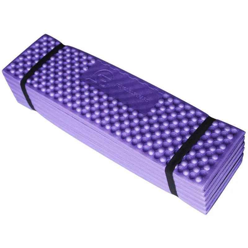 Forest green Outdoor Egg Nest folding foam pad by Mead's Supply & Equipment Outfitters, moisture-proof camping mat for outdoor use.