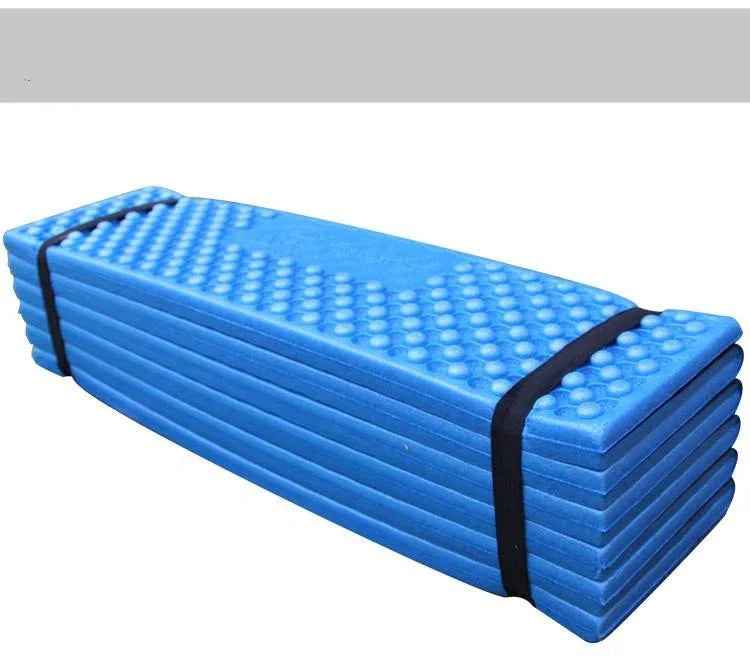 Forest green Outdoor Egg Nest folding foam pad from Mead's Supply & Equipment Outfitters, moisture-proof camping mat for outdoor camping.