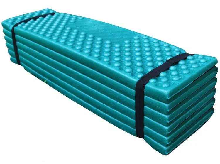 Forest green Outdoor Egg Nest folding foam pad by Mead's Supply & Equipment Outfitters, moisture-proof camping mat for outdoor use.