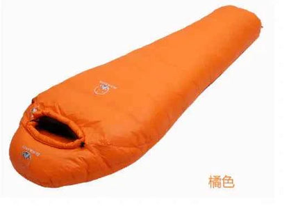 Green lightweight goose down sleeping bag by Mead's Supply & Equipment Outfitters, insulated camping gear for warmth and comfort.