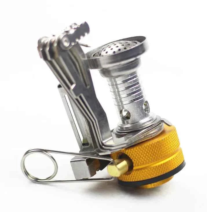 Orange portable mini camping stove by Mead's Supply & Equipment, lightweight aluminum butane burner for outdoor cooking for 1-3 people.