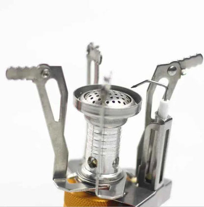 Portable mini camping stove by Mead's Supply, lightweight aluminum butane burner for outdoor cooking, suitable for 1-3 persons.