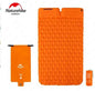 Orange outdoor inflatable mattress by Mead's Supply, moisture-proof camping sleep pad with pillow options, suitable for 1 or 2 people.