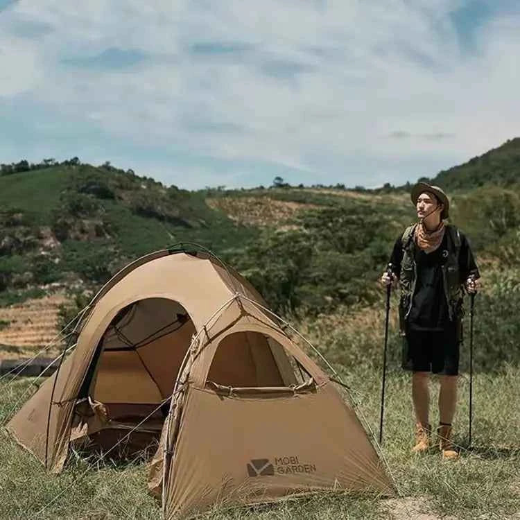 Portable outdoor camping tent with vestibule by Mead's Supply, waterproof double-layer design, aluminum frame, ideal for 1-3 persons.