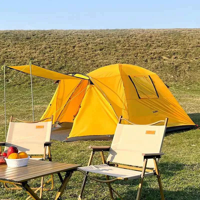 Yellow four-person outdoor camping tent by Mead's Supply & Equipment Outfitters, set up in a scenic outdoor camping area.