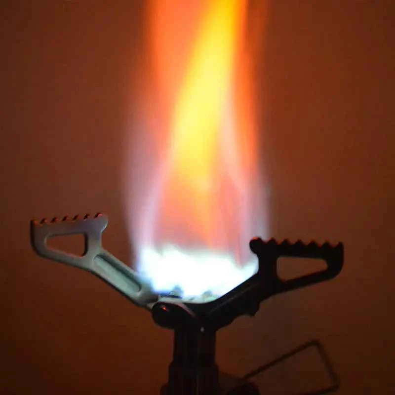 Portable outdoor titanium gas stove from Mead's Supply & Equipment Outfitters, ideal for camping and hiking adventures.