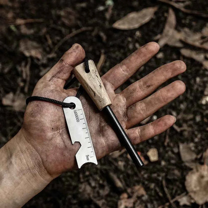 Portable outdoor flint fire starter from Mead's Supply & Equipment Outfitters, cylindrical camping gear for reliable fire ignition.
