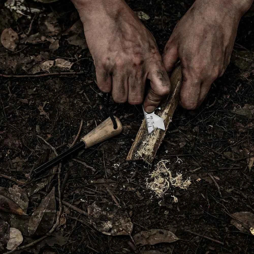 Portable Mead's Supply & Equipment Outfitters fire starter made of flint, ideal for outdoor camping and camping equipment.
