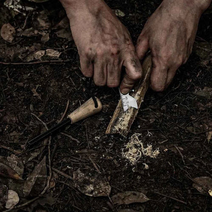 Portable Mead's Supply & Equipment Outfitters fire starter made of flint, ideal for outdoor camping and camping equipment.