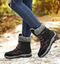 Rose red women's winter snow boots by Mead's Supply & Equipment Outfitters, designed for outdoor hiking and skiing.