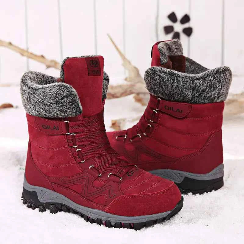 Women's winter outdoor snow boots by Mead's Supply, featuring rose-red waterproof footwear for hiking and skiing.