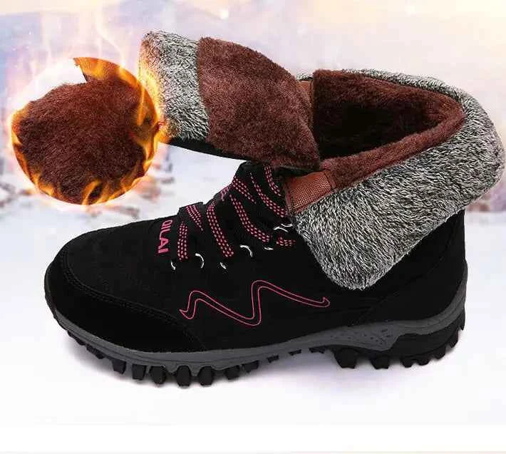 Rose red women's winter outdoor snow boots by Mead's Supply & Equipment Outfitters for hiking and skiing, with insulated waterproof design.