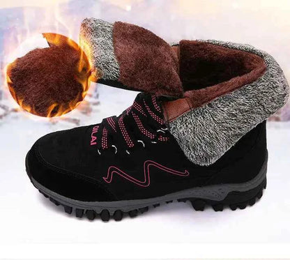 Rose red women's winter outdoor snow boots by Mead's Supply & Equipment Outfitters for hiking and skiing, with insulated waterproof design.