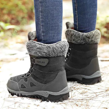 Women's Mead's Supply winter snow boots with rose-red waterproof design, ideal for hiking and skiing in snowy outdoor conditions.