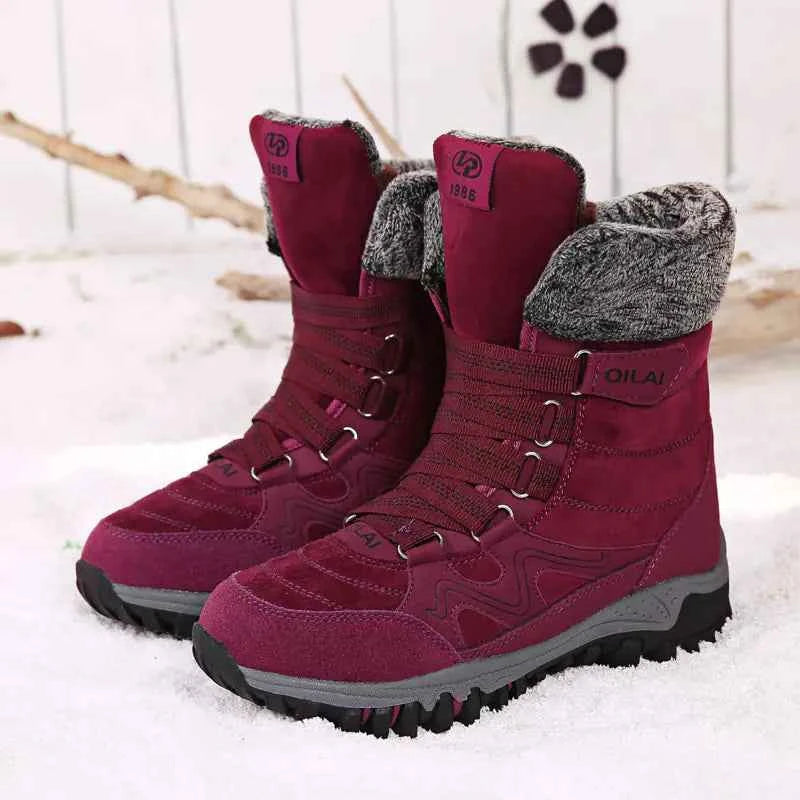 Rose red women's winter outdoor snow boots by Mead's Supply & Equipment Outfitters for hiking and skiing, with insulated waterproof design.