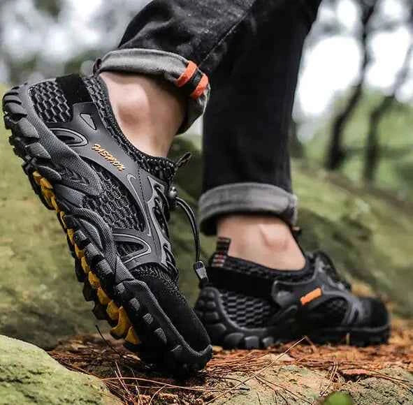 Black waterproof river trekking shoes by Mead's Supply & Equipment Outfitters, featuring non-slip soles for hiking and wading.