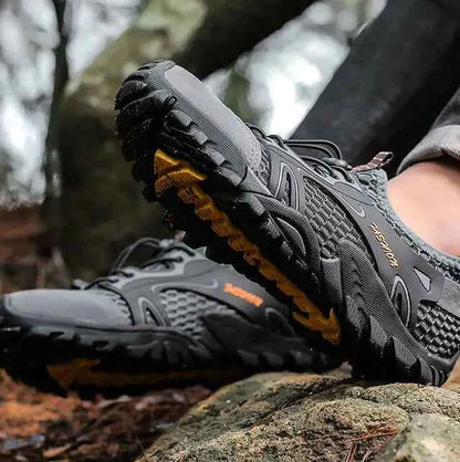 Black waterproof river trekking shoes by Mead's Supply & Equipment Outfitters, featuring non-slip soles for hiking and wading.