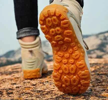 Women's waterproof hiking boots by Mead's Supply & Equipment Outfitters, lightweight climbing shoes in black, outdoor footwear.