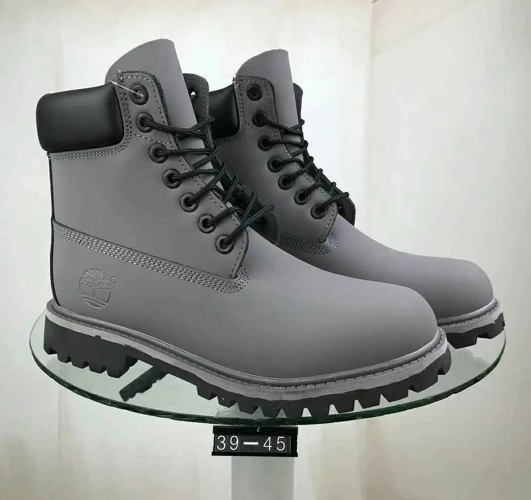 Navy blue unisex waterproof leather work boots with slip-resistant soles, designed for work and trail activities.