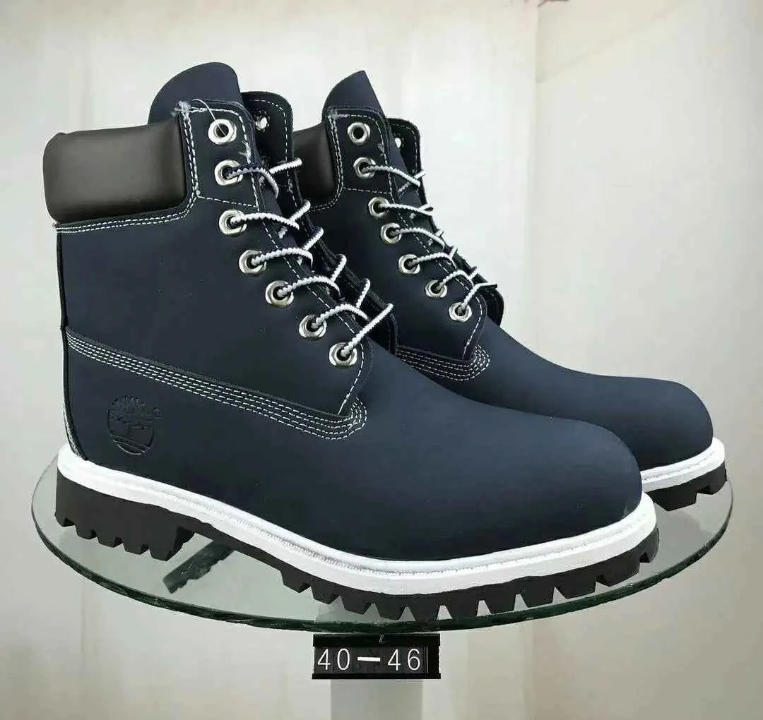 Navy blue waterproof leather work boots by Mead's Supply, unisex slip-resistant footwear designed for work and outdoor trails.