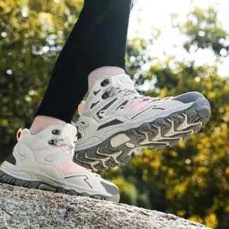 WOLFF Waterproof High-Top Trekking Shoes by Mead's Supply & Equipment Outfitters, black hiking boots with enhanced grip and sturdy design.