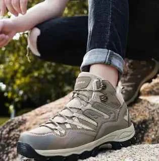 Mead's Supply & Equipment Waterproof WOLFF high-top trekking shoes with enhanced grip for hiking, black footwear with rugged sole.