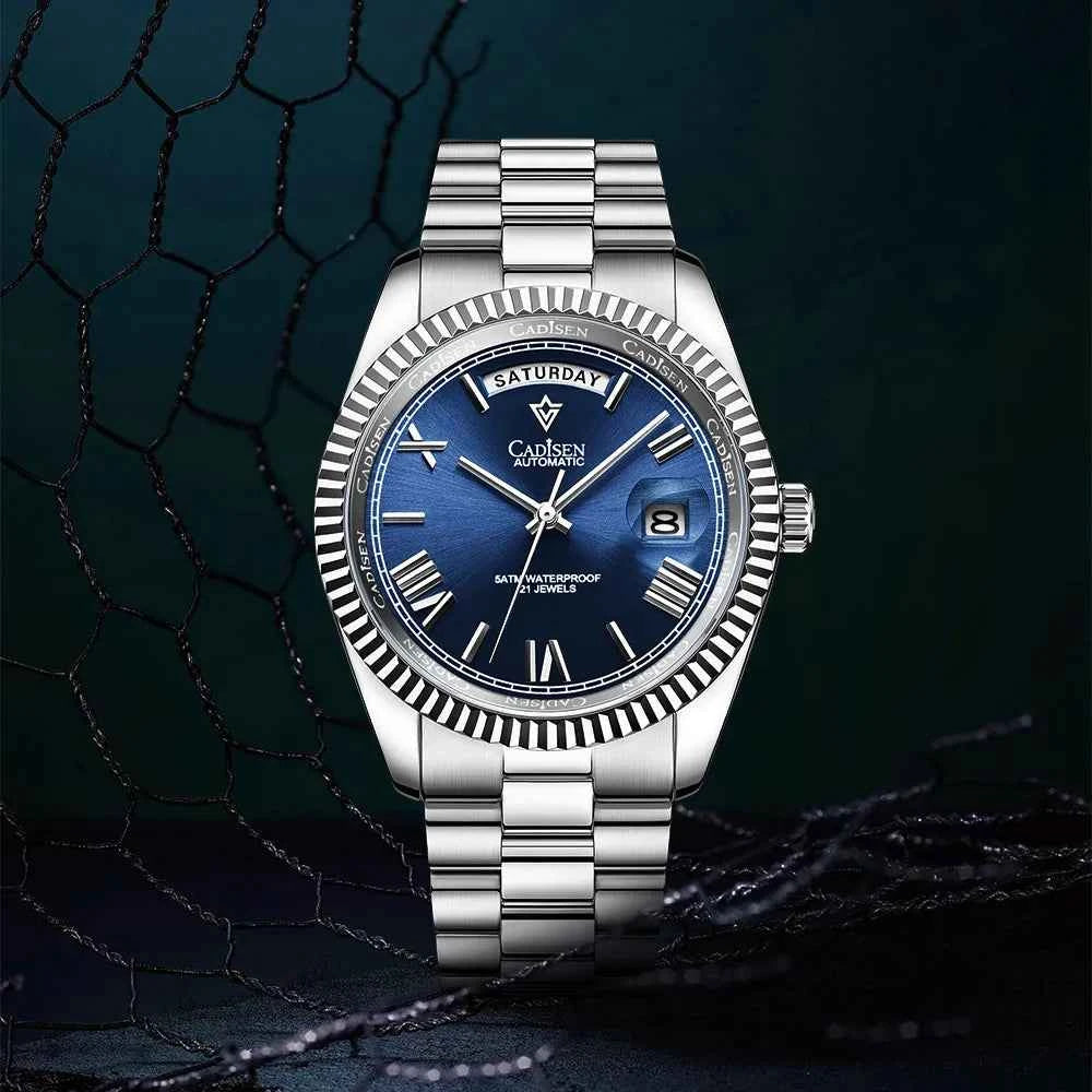 Men's Mechanical Glass Watch by Mead's Supply & Equipment, waterproof stainless steel with date display and blue steel strap.