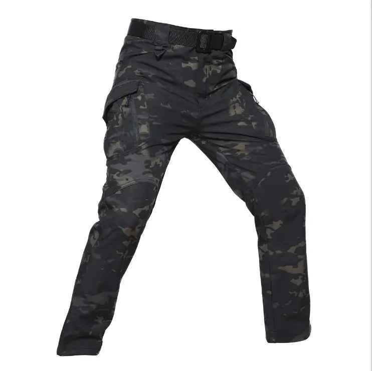 Men's tactical outdoor assault pants by Mead's Supply & Equipment in black, shark skin soft shell cargo style for military-inspired outdoor wear.