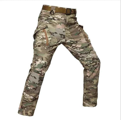 Men's tactical outdoor assault pants in black, made of shark skin soft shell fabric with cargo pockets, military style from Mead's Supply.