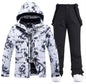 Pink men's and women's waterproof windproof ski suit by Mead's Supply & Equipment, featuring a 2-piece winter snow jacket and pants set.
