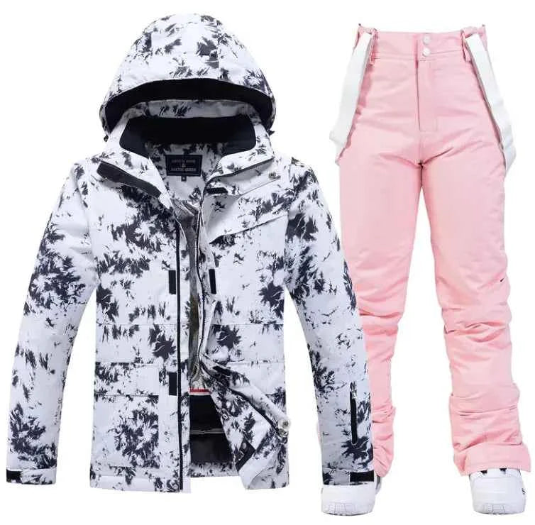 Pink men's and women's waterproof windproof ski suit by Mead's Supply & Equipment, featuring jacket and pants for winter snow skiing.