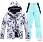 Pink men's and women's waterproof windproof ski suit by Mead's Supply & Equipment Outfitters, includes jacket and pants for winter snow sports.