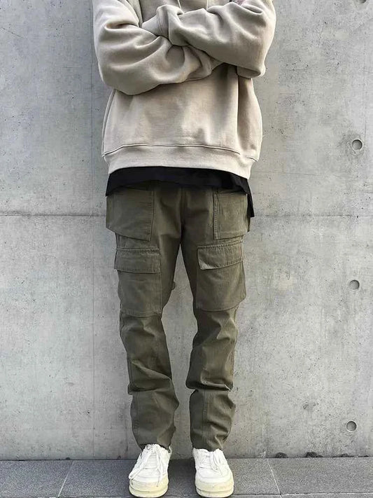 Men's army green cotton tactical cargo pants with multiple pockets, designed for outdoor wear by Mead's Supply & Equipment Outfitters.