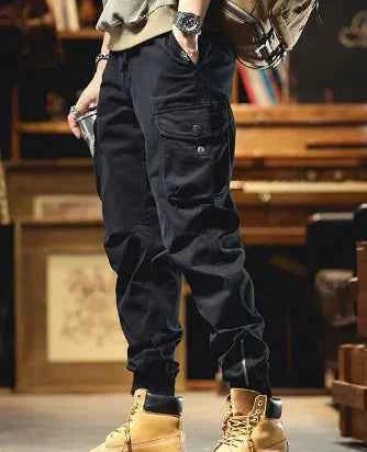Beige men's winter cotton fleece joggers from Mead's Supply & Equipment Outfitters, thick bunched casual pants for cold weather.