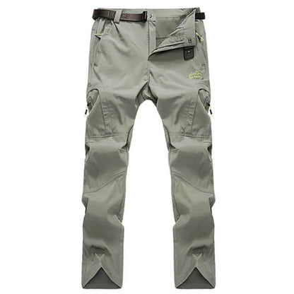 Men's black and grey quick-drying outdoor hiking pants by Mead's Supply & Equipment Outfitters, waterproof, breathable, and UV resistant.