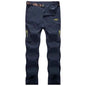Men's black and grey quick-drying outdoor hiking pants by Mead's Supply & Equipment Outfitters, waterproof, anti-UV, breathable trekking pants.