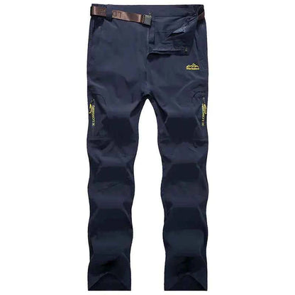 Men's black and grey quick-drying outdoor hiking pants by Mead's Supply & Equipment Outfitters, waterproof and breathable trekking pants.