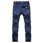 Men's black and grey quick-drying outdoor hiking pants from Mead's Supply & Equipment Outfitters, waterproof, anti-UV, breathable trekking pants.